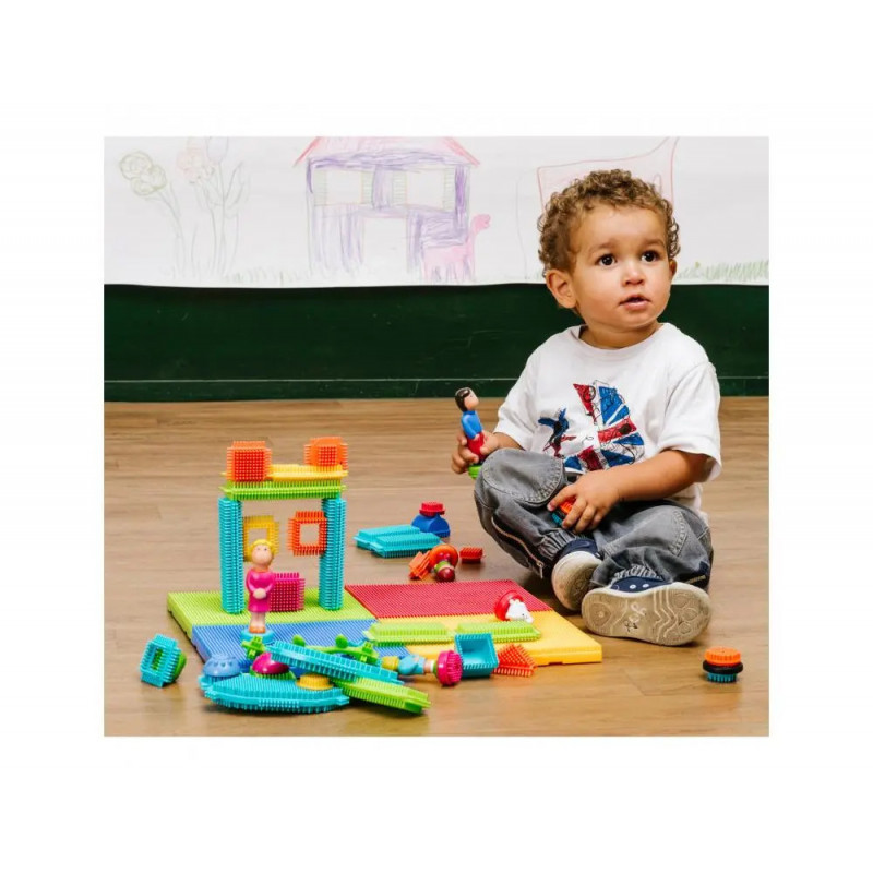 Bristle blocks lap 85 pieces plastiques de formes et personnages varies coloris assortis